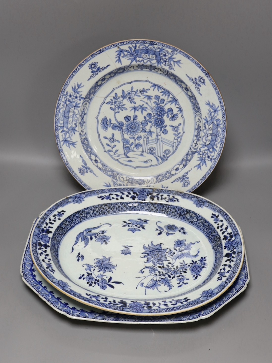 Three Chinese export blue and white dishes, 18th/19th century, largest 42cms wide